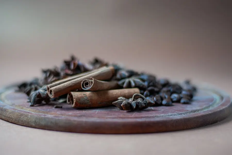 Cinnamon sticks and star anise on a wooden board